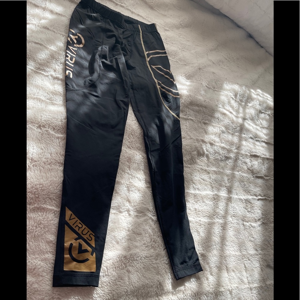 black and gold virus leggings